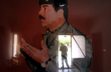 A man walked out of the door in the house of Saddam Hussein’s mother in the town of Tikhrit